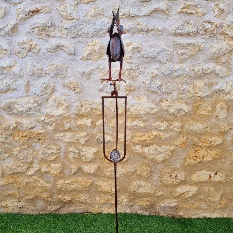 Decoratieve tuinbalans van ijzer met kleurrijk uilenmotief, zijaanzicht