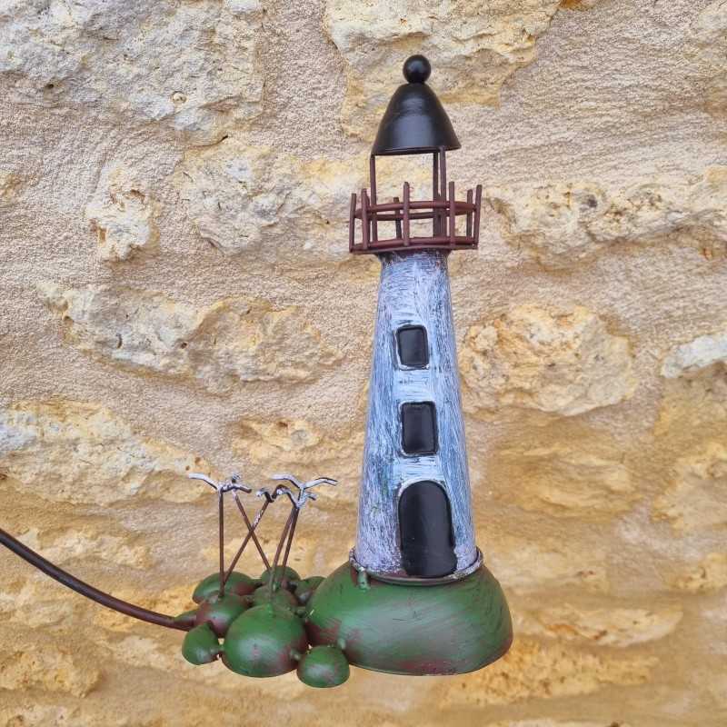 Balansgewicht vuurtoren en boot