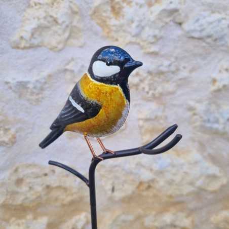 Decoratieve vogel op gele pin