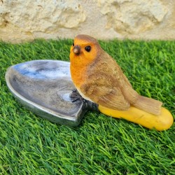 Voeder- en drinkbak voor vogels van hars in de vorm van een schep