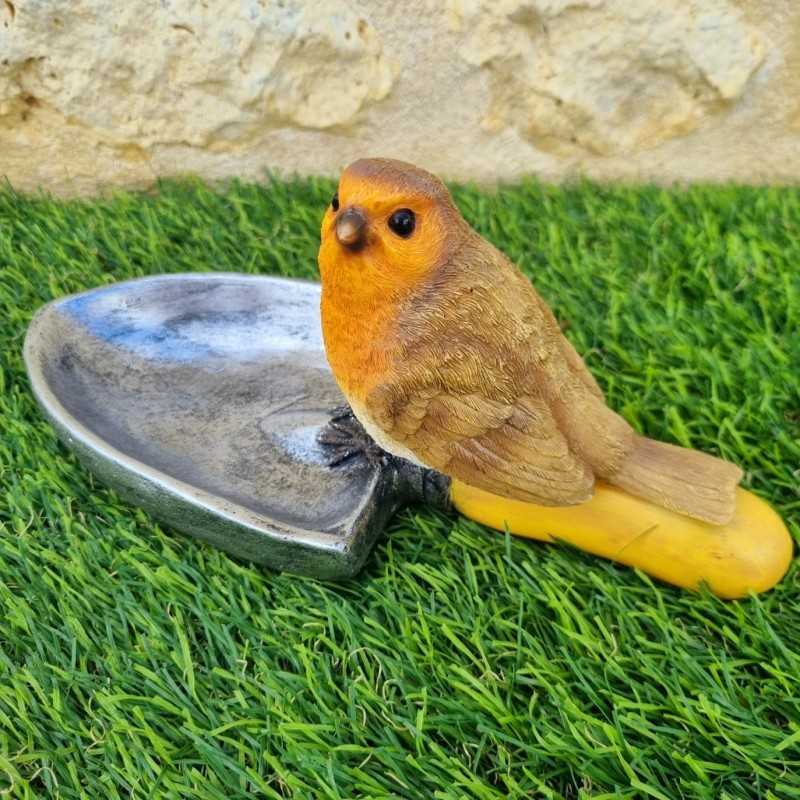 Voeder- en drinkbak voor vogels van hars in de vorm van een schep