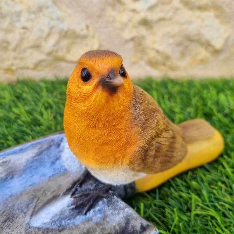 Voeder- en drinkbak voor vogels van hars in de vorm van een schep