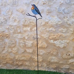Decoratieve vogel op oranje prikker
