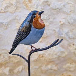 Decoratieve vogel op oranje prikker