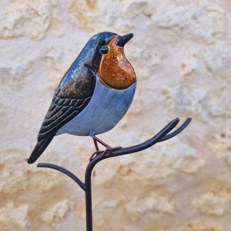 Decoratieve vogel op oranje prikker
