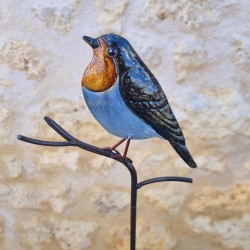 Decoratieve vogel op oranje prikker